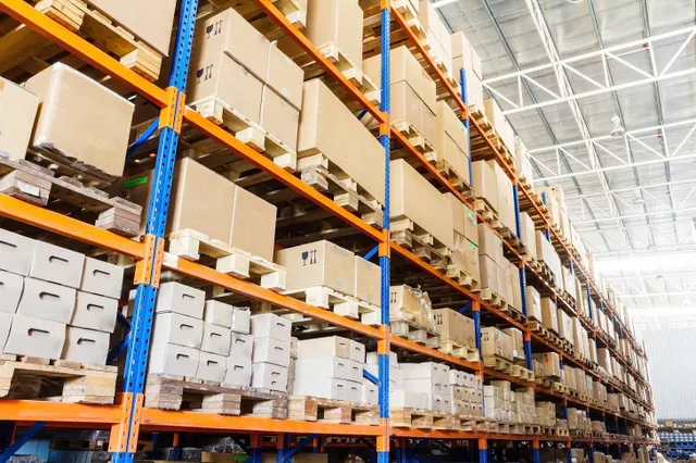 business boxes and files stored on warehouse brackets